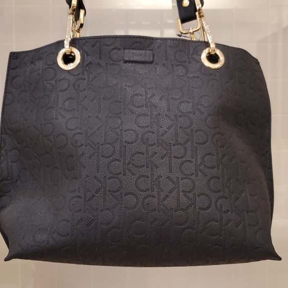 Calvin Klein Handbags - Calvin Klein Black Embossed Logo Small Tote